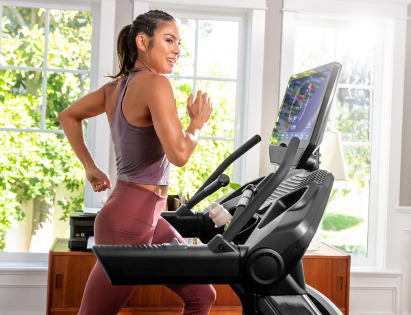 woman running on a Treadmill 22 in a sunny room