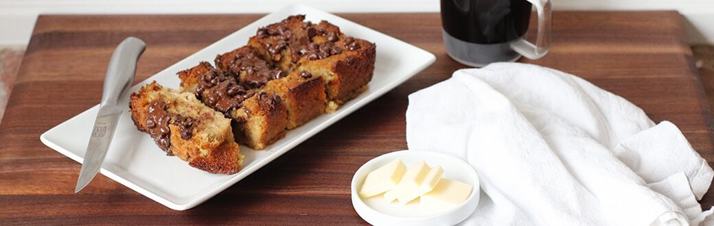 Sliced chocolate chip banana bread on a plate.