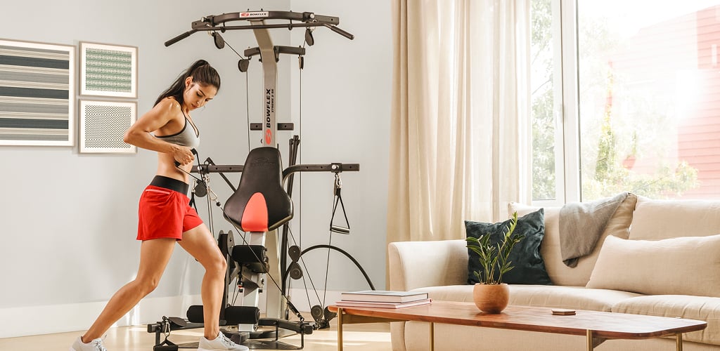 woman using a bowflex homegym
