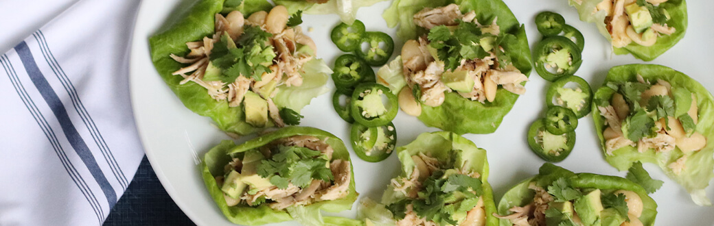 Chicken and white bean lettuce wraps on a plate.