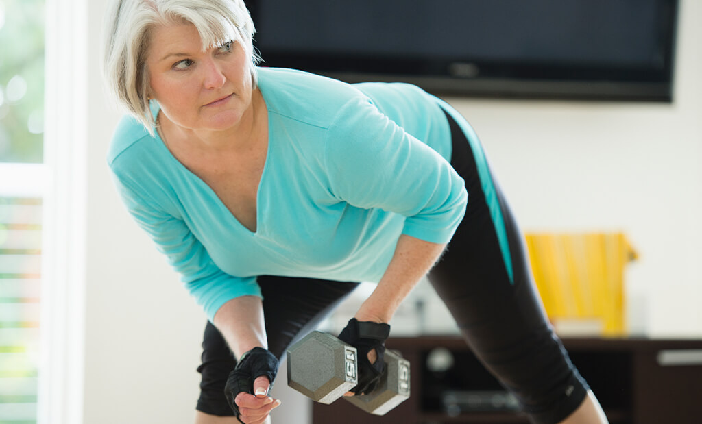 A woman performing a bent over row