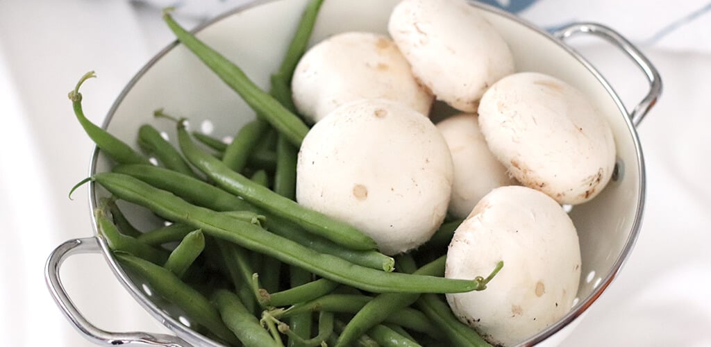 fresh green beans and mushrooms in a bowl