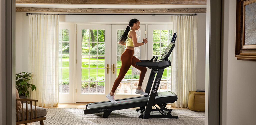 Woman running on a bowflex treadmill