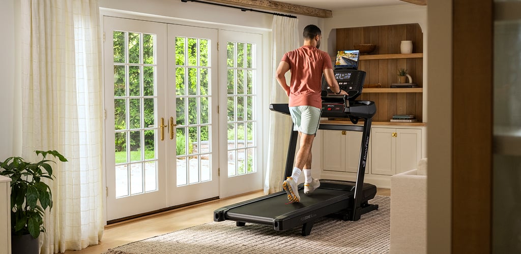 man running on a bowflex treadmill