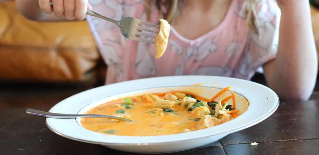 A bowl of coconut curry soup