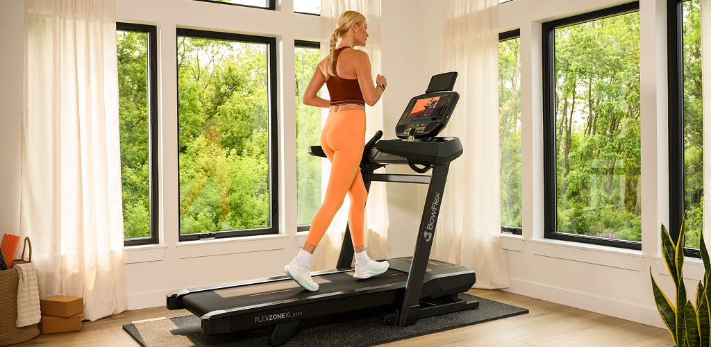 woman running on a bowflex treadmill