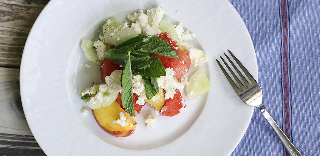 Prepared watermelon, Peach & Feta Summer Salad on a plate.