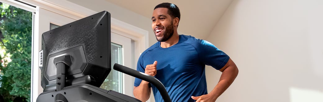 A man running on a bowflex Treadmill.