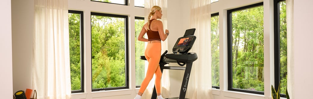 woman running on the bowflex treadmill