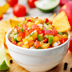 Close up image of fresh peach picco de gallo.