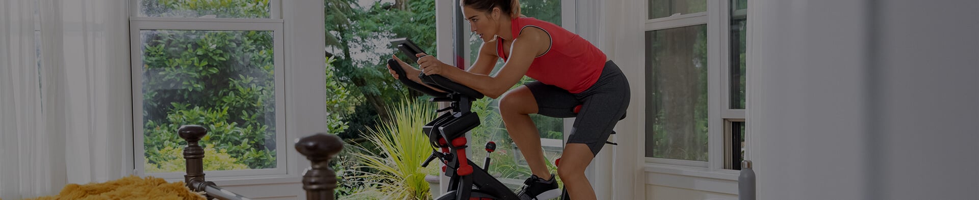 A woman using the BowFlex C6 Bike