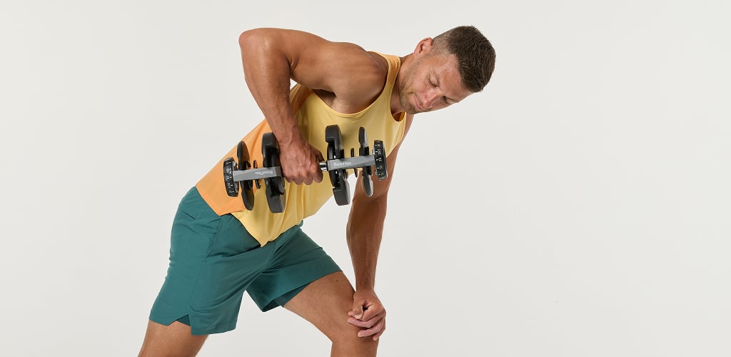 man using selettech dumbbell
