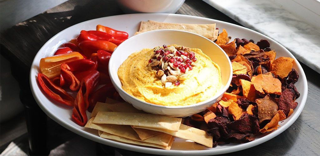 Pumpkin hummus in a serving dish.