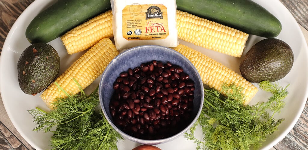 The ingredients needed to make cucumber and black bean salad.