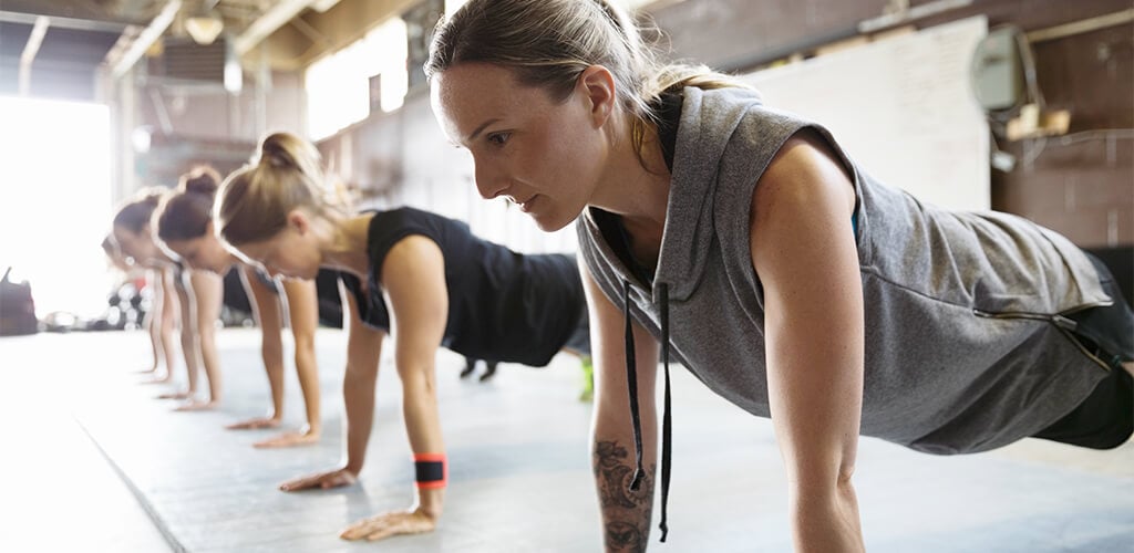 People performing push ups.