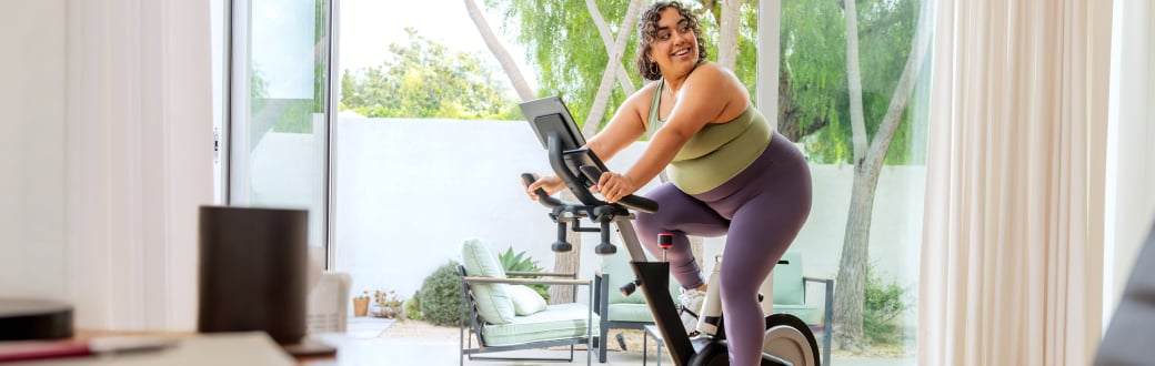 woman riding an exercise bike