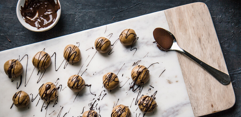 Peanut Butter Energy Bites drizzled with chocolate