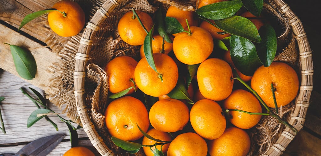 Small citrus fruits in a basket.