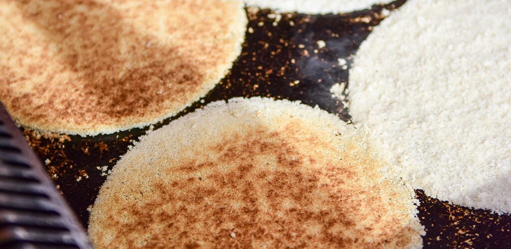 Cassava flour tortillas cooking in a pan