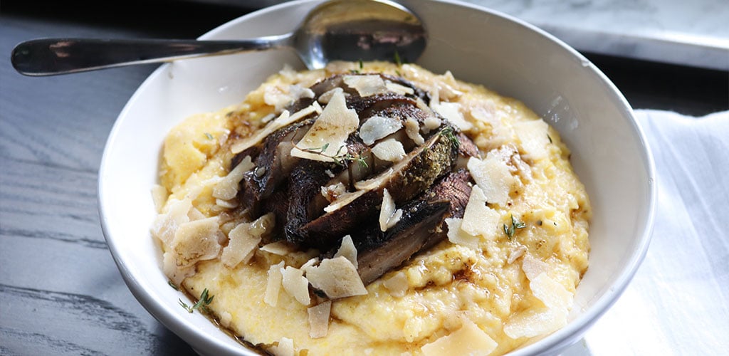 Roasted mushroom polenta in a serving dish.