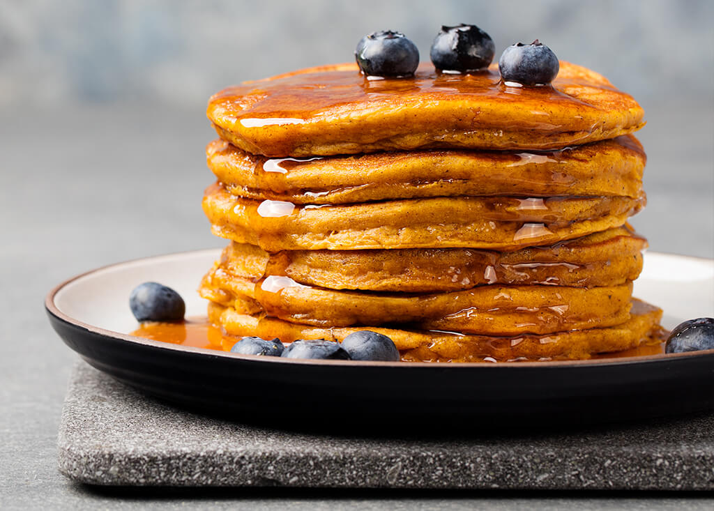 a stack of sweet potato pancakes