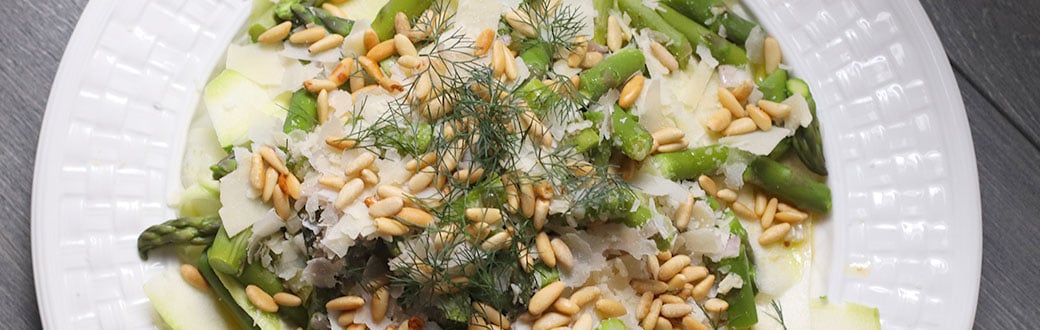 Zucchini and asparagus salad on a plate.