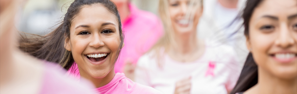Several women in pink. Breast Cancer Awareness Month