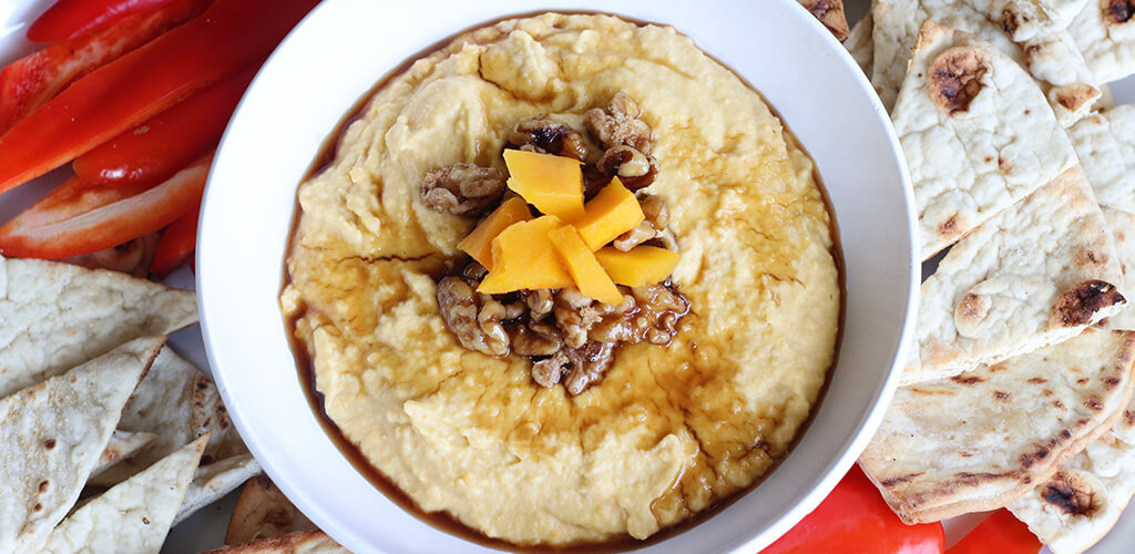 A bowl of butternut squash hummus.