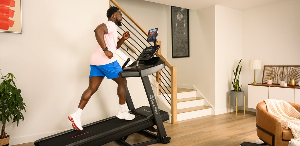 man running on a bowflex treadmill