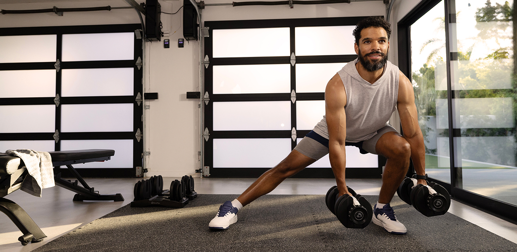 man using a bowflex dumbbell