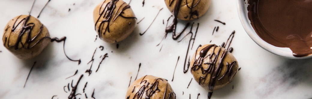 Balls of peanut butter drizzled with chocolate