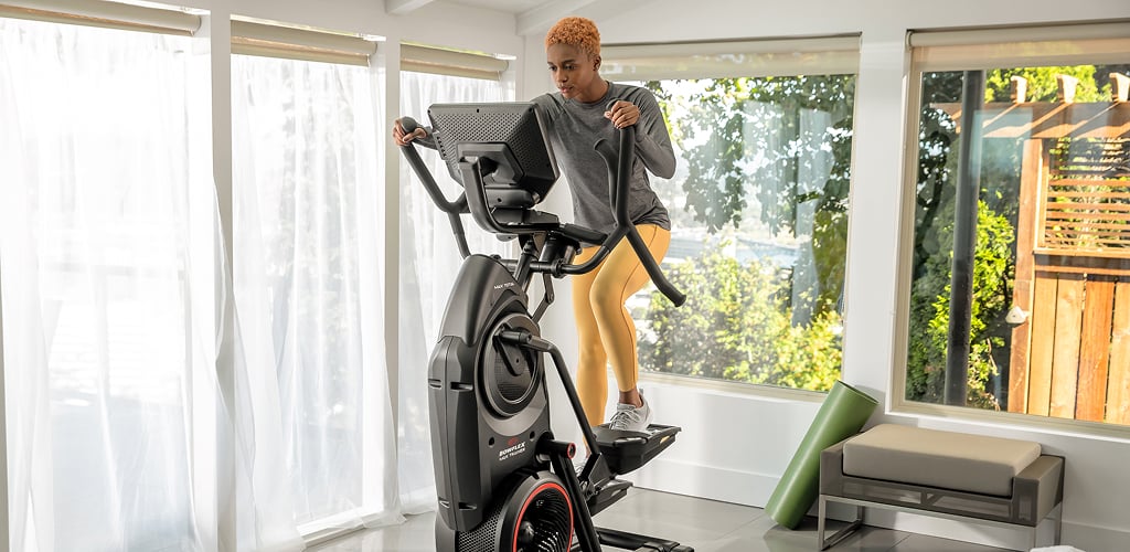 woman using a bowflex max trainer