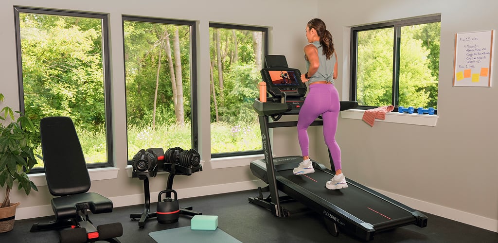 woman on a bowflex treadmill