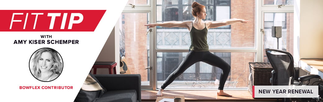 A fit woman performing a yoga pose.