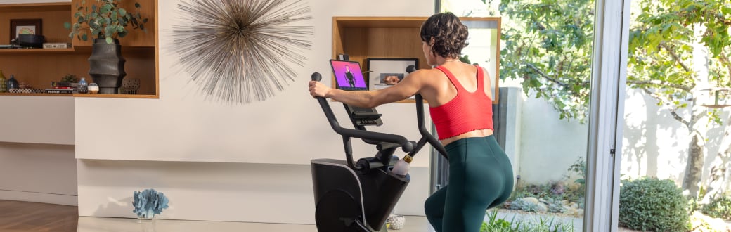 Woman using a max trainer