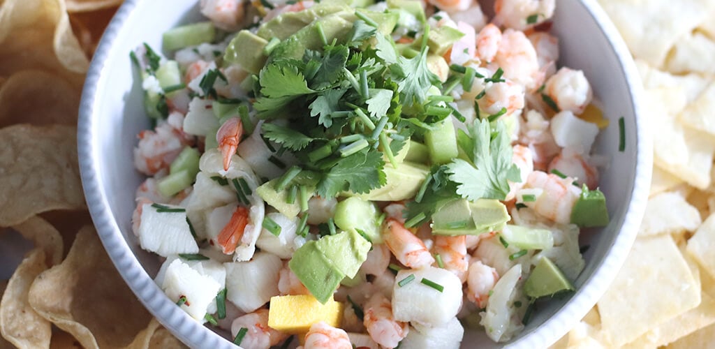 Sea bass and shrip ceviche in a serving dish.