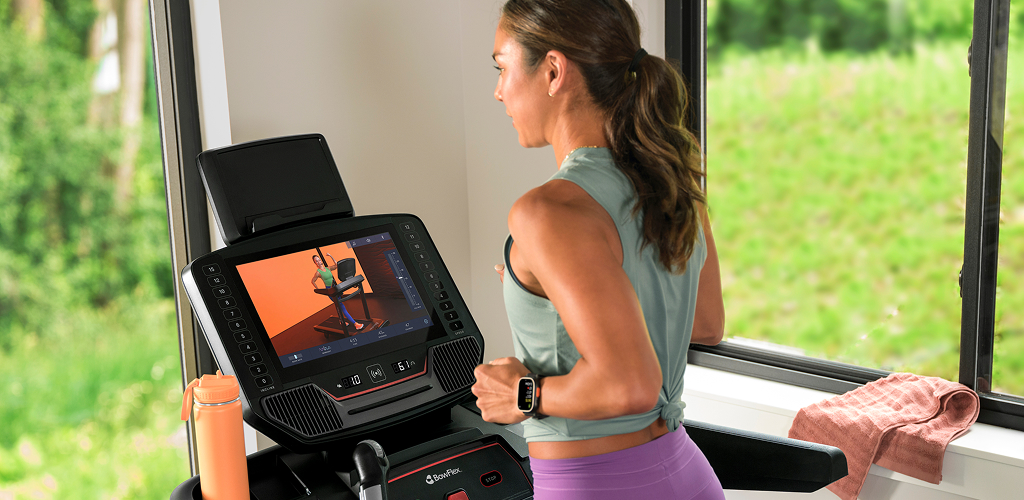 woman running on a bowflex treadmill