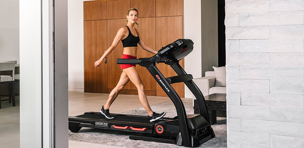 Woman walking on a treadmill