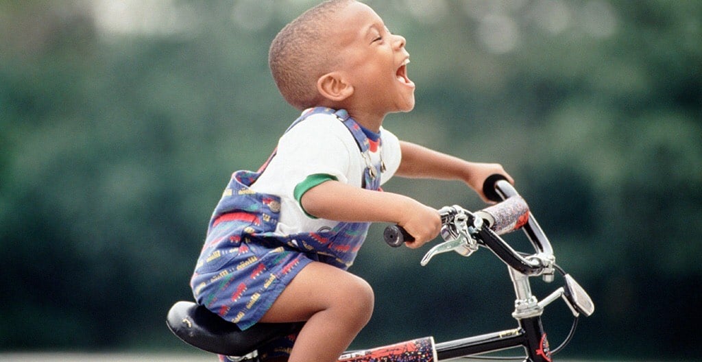 Young boy riding a bike